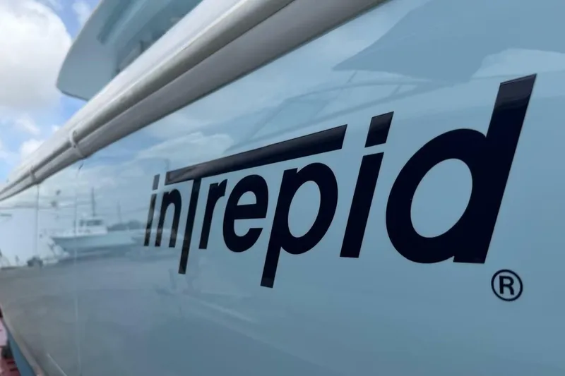 Slide: The Image of Side view of a 2020 Intrepid 375 Nomad SE boat with logo. - 2