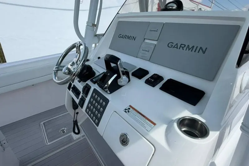 Slide: The Image of 2020 Intrepid 375 Nomad SE helm with Garmin navigation system and sleek controls. - 5