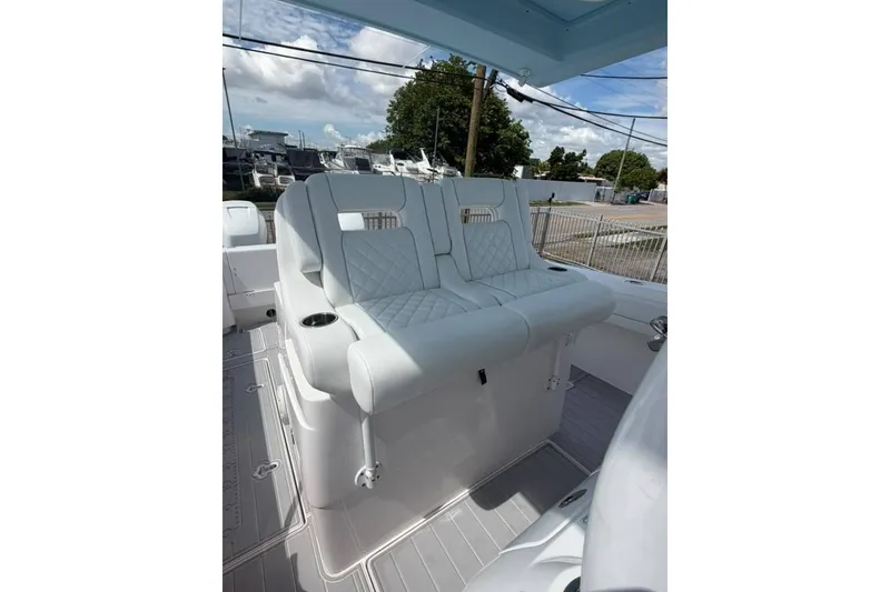 Slide: The Image of 2020 Intrepid 375 Nomad SE boat seating with quilted upholstery and cup holders. - 7