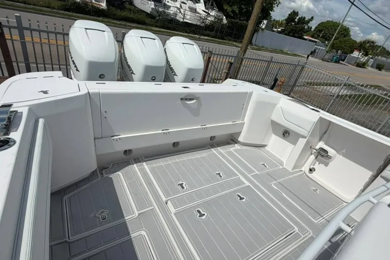 Slide: The Image of 2020 Intrepid 375 Nomad SE boat deck with triple Mercury outboard engines. - 9