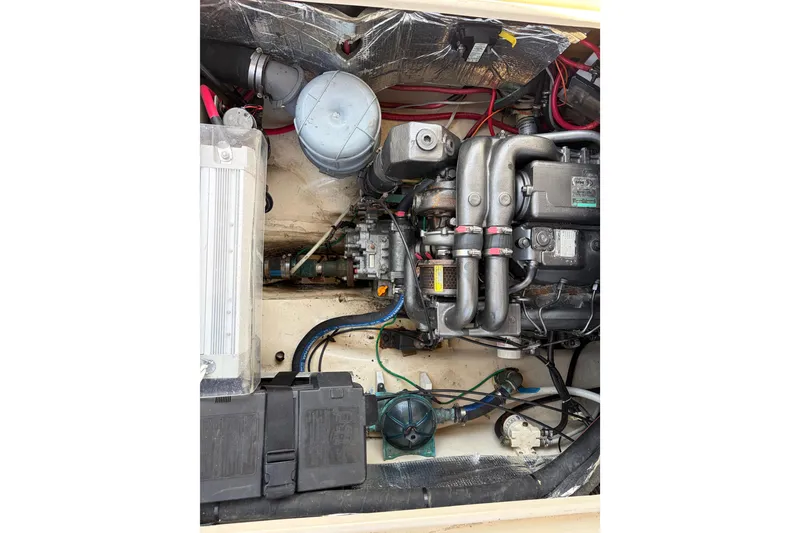 Slide: The Image of Engine compartment of a 2008 Ranger Tugs R-25 boat, showcasing mechanical components. - 16