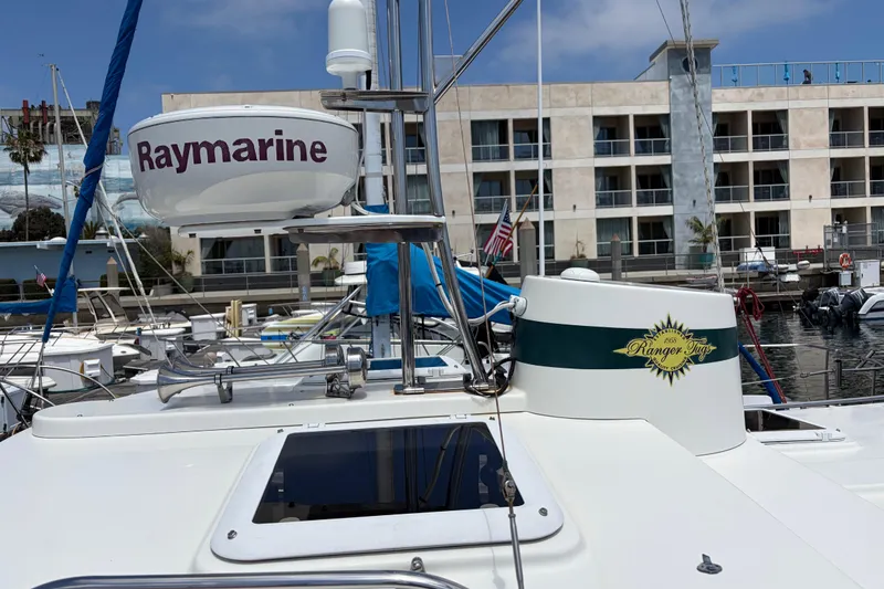 Slide: The Image of 2008 Ranger Tugs R-25 boat docked, featuring Raymarine equipment and marina backdrop. - 5