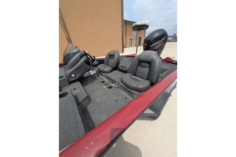 Slide: The Image of 2019 Tracker Pro Team 190 boat interior with seats and Mercury engine. - 10