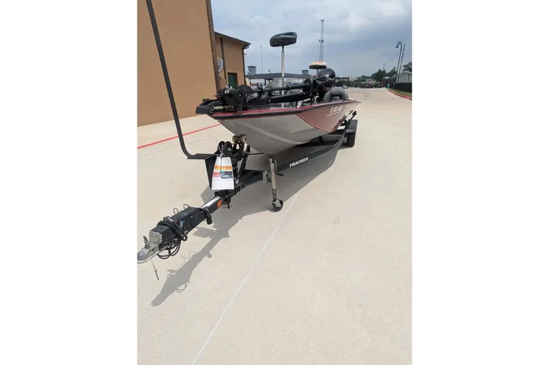 Slide: The Image of 2019 Tracker Pro Team 190 boat on trailer, parked outdoors. - 5