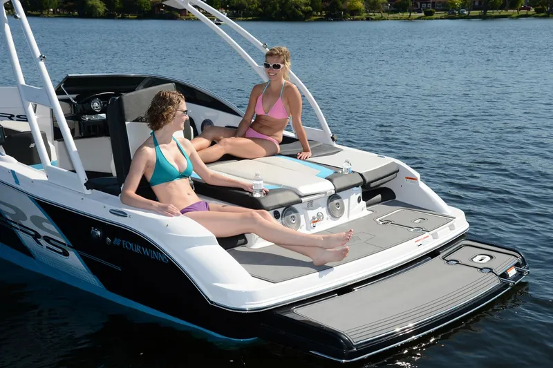 Slide: The Image of Manufacturer Provided Image: 2016 Four Winns H200RS boat with two women relaxing on the deck. - 10