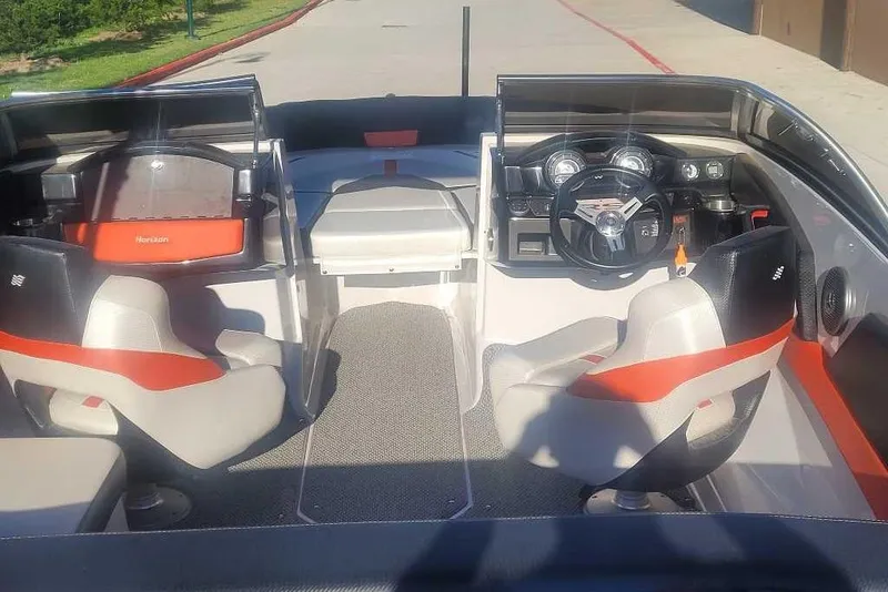 Slide: The Image of 2016 Four Winns H200RS boat interior with modern dashboard and seating. - 2