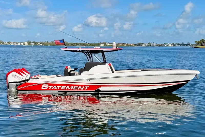 The Image of 2023 Statement 350 Open boat on calm water, featuring sleek design and vibrant red accents. - 1