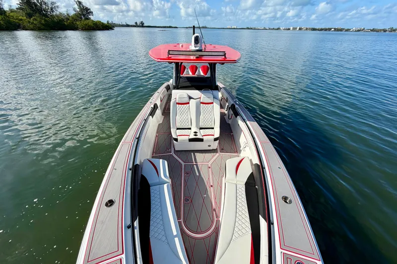Slide: The Image of 2023 Statement 350 Open boat on calm water, featuring sleek design and luxurious seating. - 11