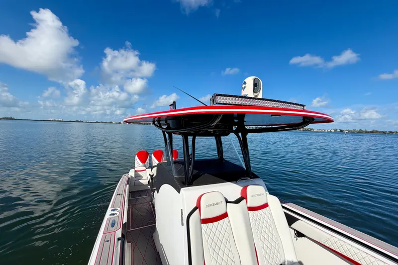 Slide: The Image of 2023 Statement 350 Open boat on calm water under a clear blue sky. - 13