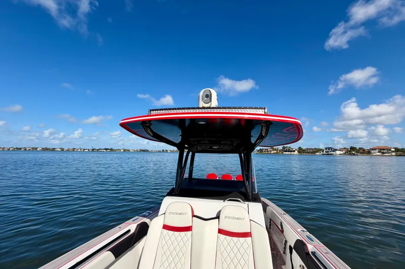 Slide: The Image of 2023 Statement 350 Open boat on calm water under clear blue sky. - 14