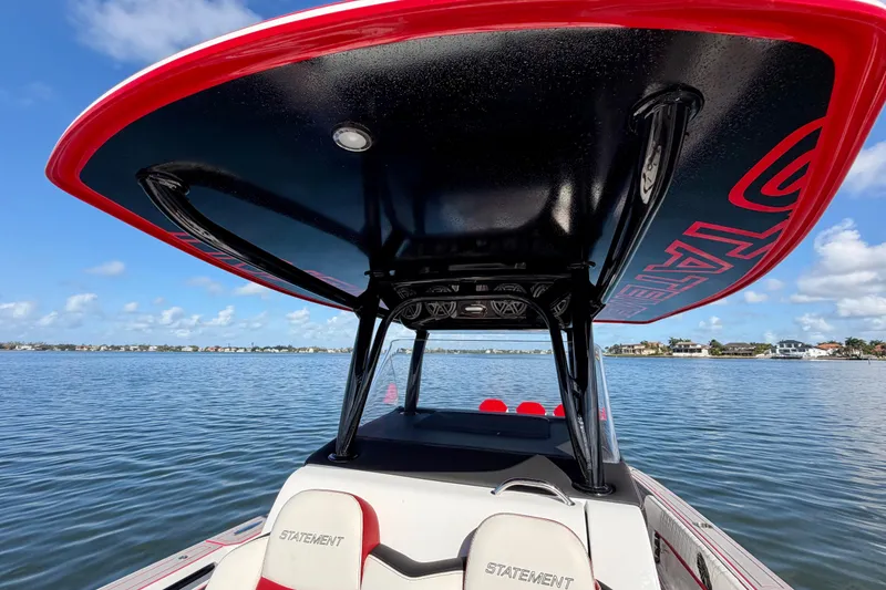 Slide: The Image of 2023 Statement 350 Open boat on calm water, featuring sleek design and modern canopy. - 15