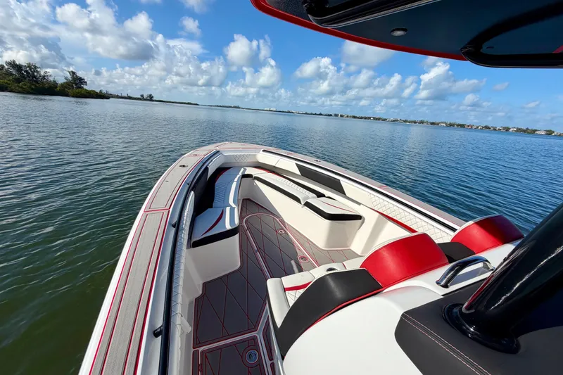 Slide: The Image of 2023 Statement 350 Open boat on calm water, featuring sleek design and luxurious seating. - 16