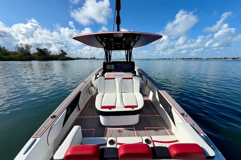 Slide: The Image of 2023 Statement 350 Open boat interior with luxurious seating on calm water. - 18