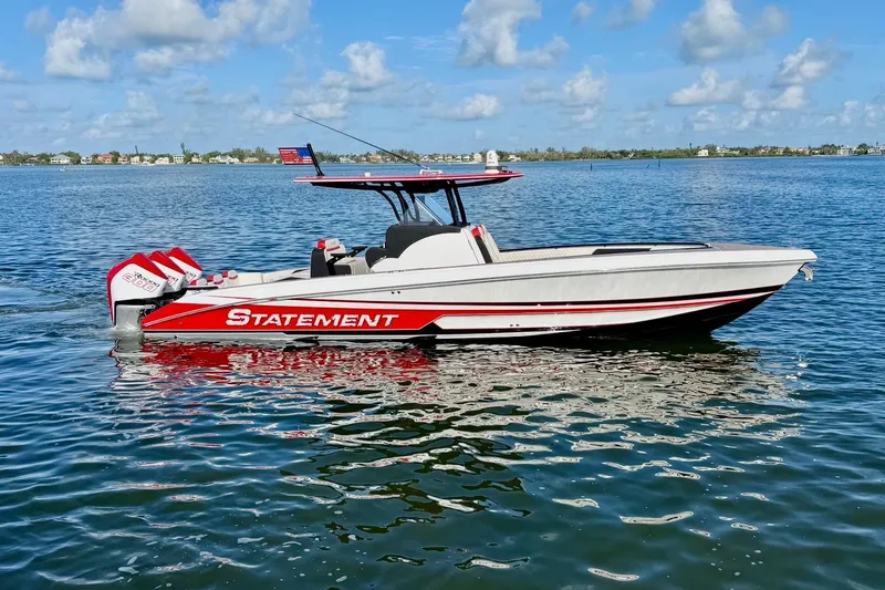 Slide: The Image of 2023 Statement 350 Open boat on calm water, featuring sleek design and vibrant colors. - 2