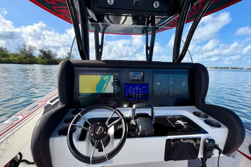 Slide: The Image of Cockpit of 2023 Statement 350 Open boat with advanced navigation displays and steering wheel. - 23