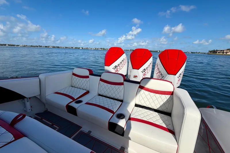 Slide: The Image of 2023 Statement 350 Open boat with luxurious seating and powerful engines on a serene lake. - 25