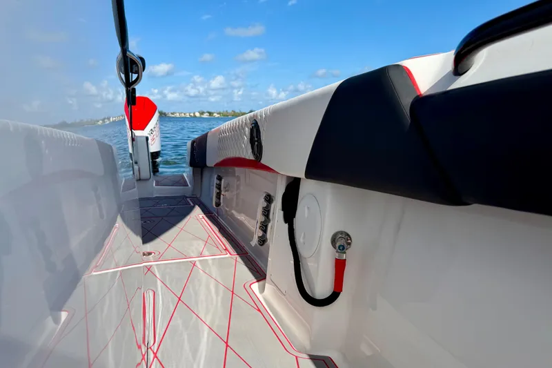 Slide: The Image of 2023 Statement 350 Open boat interior with sleek design on open water. - 28