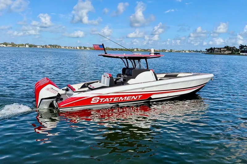 Slide: The Image of 2023 Statement 350 Open boat on calm water, featuring sleek design and vibrant red accents. - 4