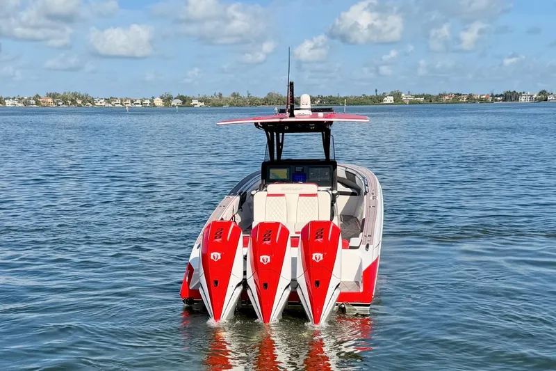 Slide: The Image of 2023 Statement 350 Open boat with triple engines on calm water. - 5