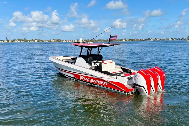 Slide: The Image of 2023 Statement 350 Open boat with triple engines on a sunny day. - 6