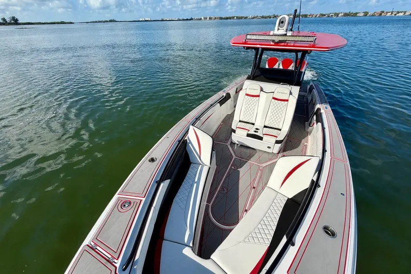 Slide: The Image of 2023 Statement 350 Open boat on calm water, featuring sleek design and luxurious seating. - 9
