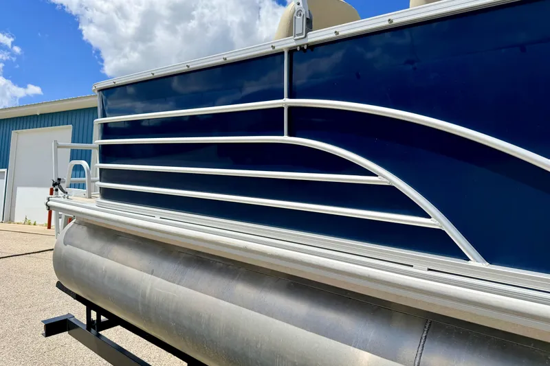 Slide: The Image of 2018 Sylvan 8522 Mirage Fish pontoon boat with blue paneling and aluminum railing. - 15