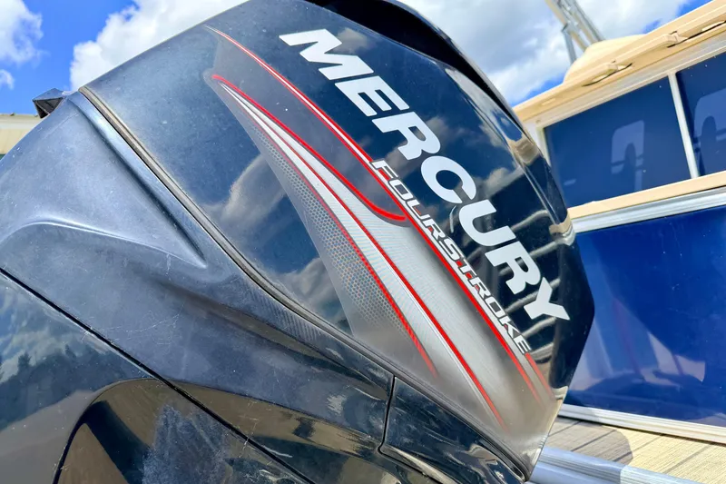 Slide: The Image of Mercury FourStroke engine on 2018 Sylvan 8522 Mirage Fish boat under blue sky. - 17