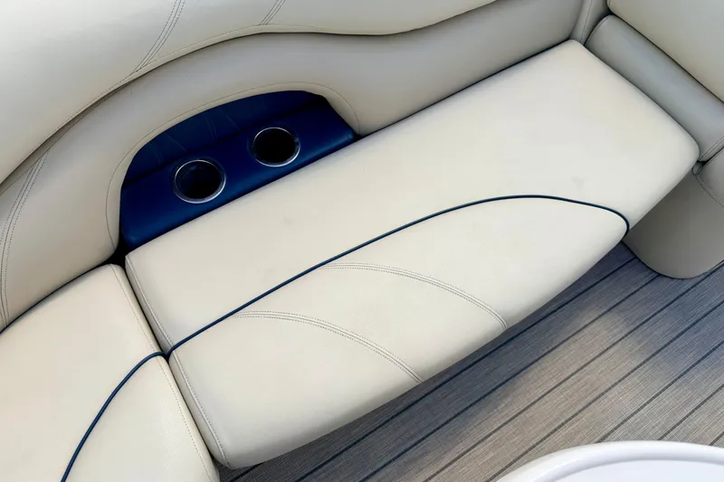Slide: The Image of 2018 Sylvan 8522 Mirage Fish boat interior with beige seating and cup holders. - 25
