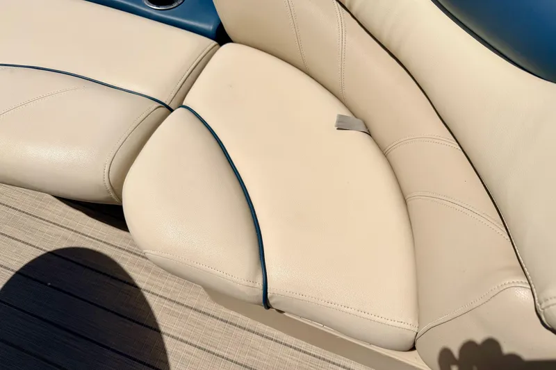 Slide: The Image of 2018 Sylvan 8522 Mirage Fish boat seat with beige upholstery and blue accents. - 28