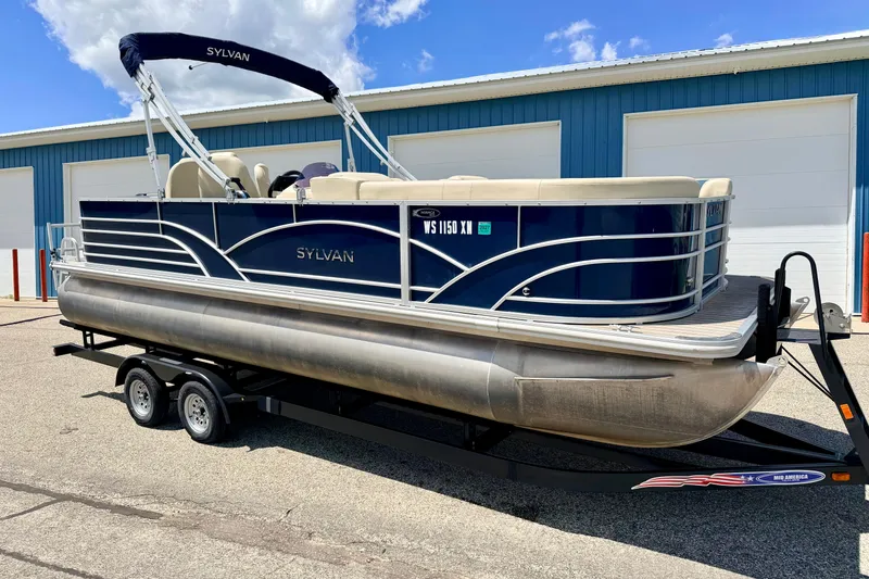 Slide: The Image of 2018 Sylvan 8522 Mirage Fish pontoon boat on trailer, parked outdoors. - 3