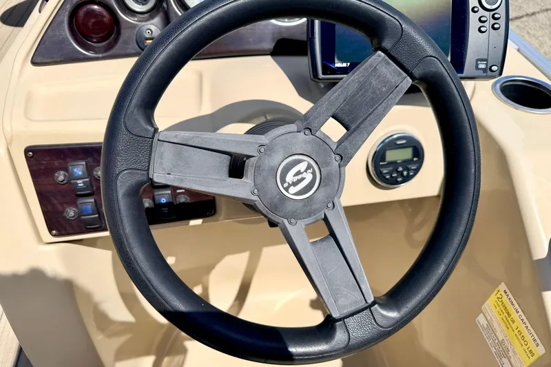 Slide: The Image of Steering wheel of 2018 Sylvan 8522 Mirage Fish boat with dashboard controls. - 40