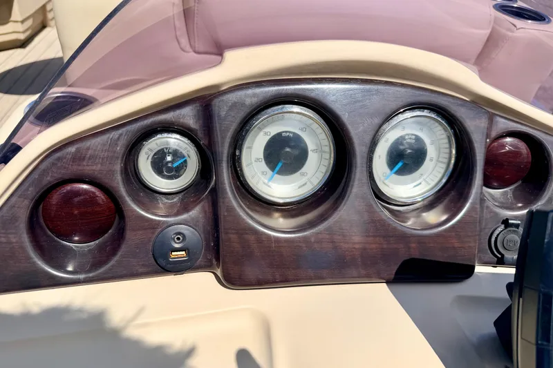 Slide: The Image of Dashboard of 2018 Sylvan 8522 Mirage Fish boat with gauges and USB port. - 42