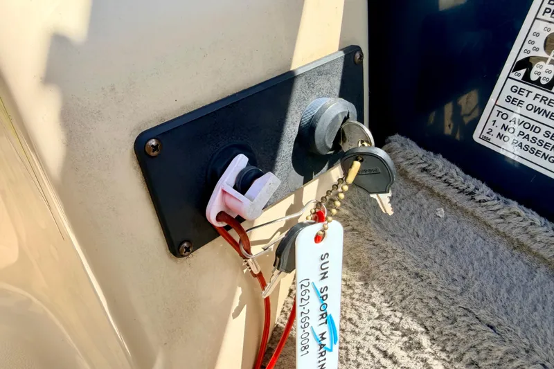 Slide: The Image of Key ignition panel of 2018 Sylvan 8522 Mirage Fish boat with keys attached. - 45