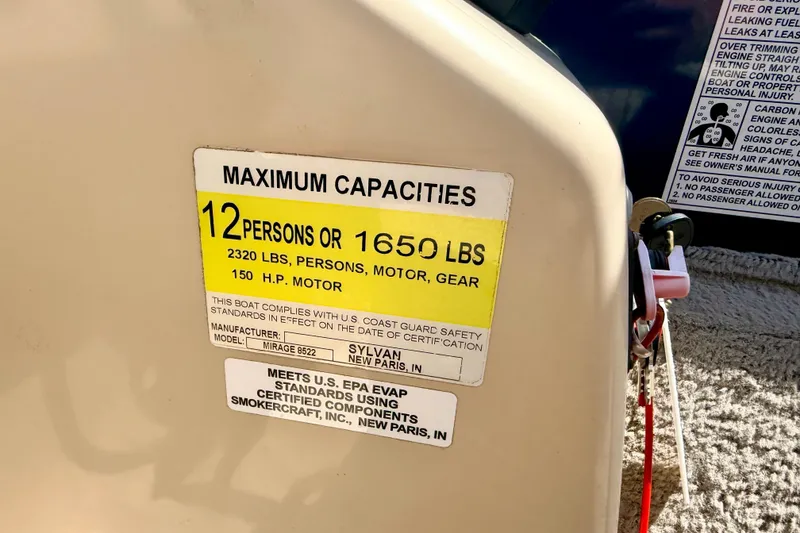 Slide: The Image of 2018 Sylvan 8522 Mirage Fish boat capacity label, 12 persons or 1650 lbs, 150 HP motor. - 46