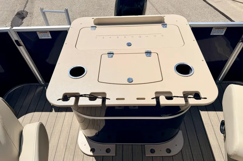 Slide: The Image of 2018 Sylvan 8522 Mirage Fish boat deck with beige fishing station and cup holders. - 50