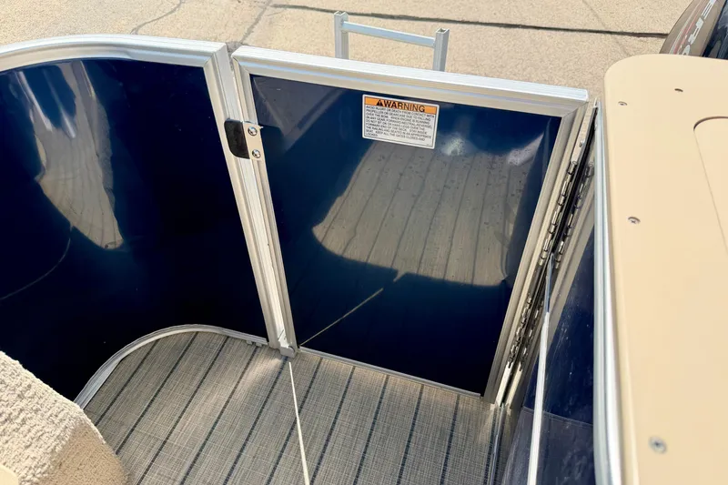 Slide: The Image of 2018 Sylvan 8522 Mirage Fish boat gate with warning label and striped flooring. - 58