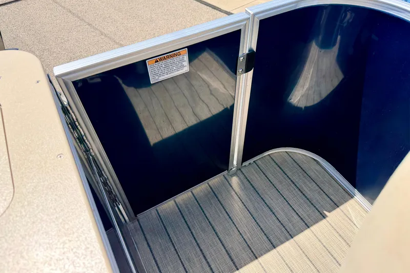 Slide: The Image of 2018 Sylvan 8522 Mirage Fish boat interior with blue panel and warning label. - 59