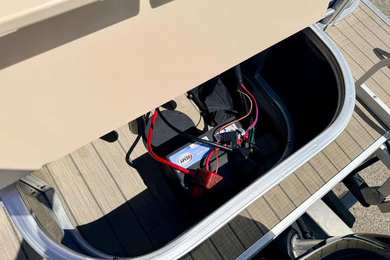 Slide: The Image of Battery compartment of 2018 Sylvan 8522 Mirage Fish boat with wiring visible. - 62