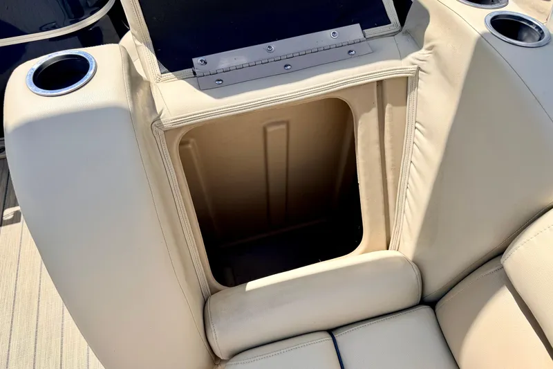 Slide: The Image of 2018 Sylvan 8522 Mirage Fish boat seat storage compartment with cup holders. - 64