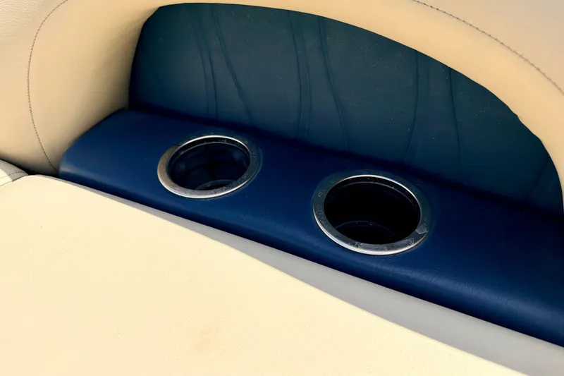 Slide: The Image of Cup holders on 2018 Sylvan 8522 Mirage Fish boat seat, featuring beige and blue upholstery. - 70