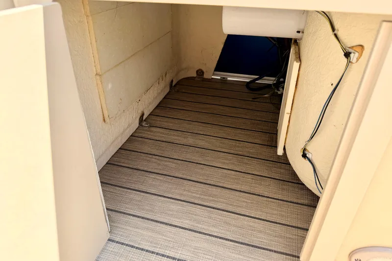 Slide: The Image of Interior storage compartment of 2018 Sylvan 8522 Mirage Fish boat, featuring striped flooring. - 73