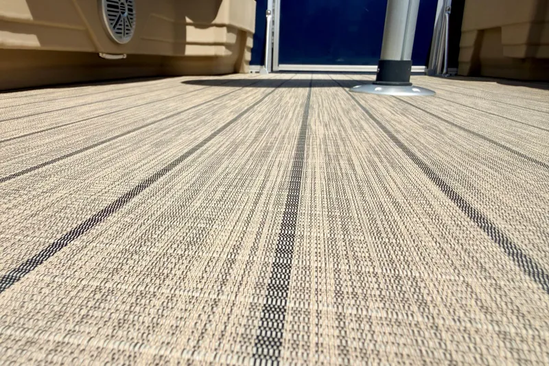 Slide: The Image of 2018 Sylvan 8522 Mirage Fish boat deck with textured flooring and speaker detail. - 74