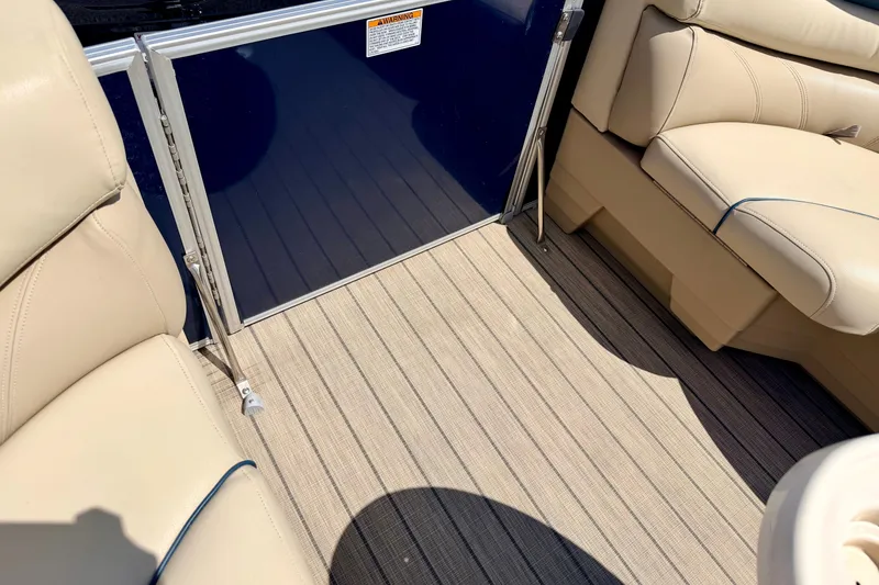 Slide: The Image of Interior of 2018 Sylvan 8522 Mirage Fish boat with beige seating and striped flooring. - 77