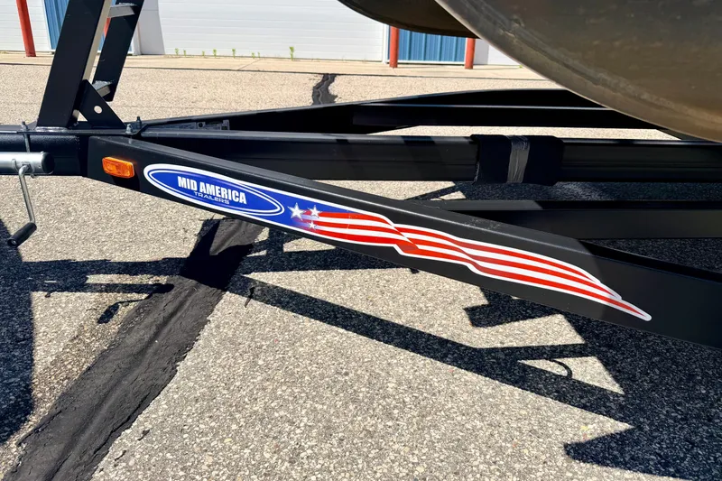 Slide: The Image of Trailer hitch of a 2018 Sylvan 8522 Mirage Fish with Mid America branding. - 78