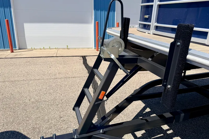 Slide: The Image of Trailer ladder and winch of 2018 Sylvan 8522 Mirage Fish boat in parking lot. - 80