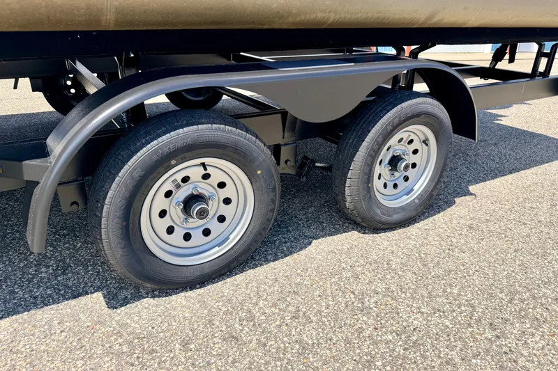 Slide: The Image of Trailer wheels of a 2018 Sylvan 8522 Mirage Fish on asphalt surface. - 81