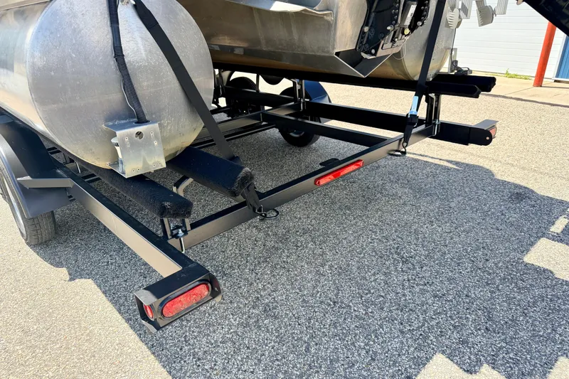 Slide: The Image of Trailer for 2018 Sylvan 8522 Mirage Fish pontoon boat on asphalt surface. - 82