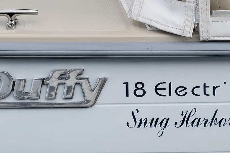 Slide: The Image of Close-up of 2008 Duffy Snug Harbor 18 Electric boat branding. - 12
