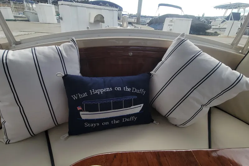 Slide: The Image of Cozy seating on 2008 Duffy Snug Harbor 18 with nautical-themed pillows. - 5