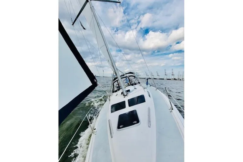 The Image of Sailing on a 2002 Hunter 356 yacht under a partly cloudy sky. - 0